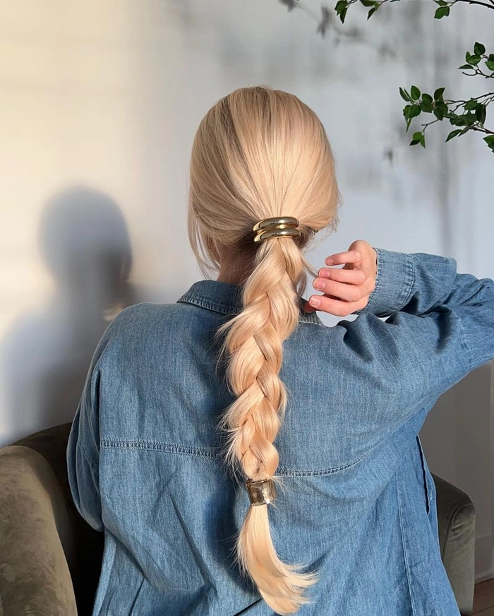 Woman with a simple rope braid ponytail styled for sporty casual days