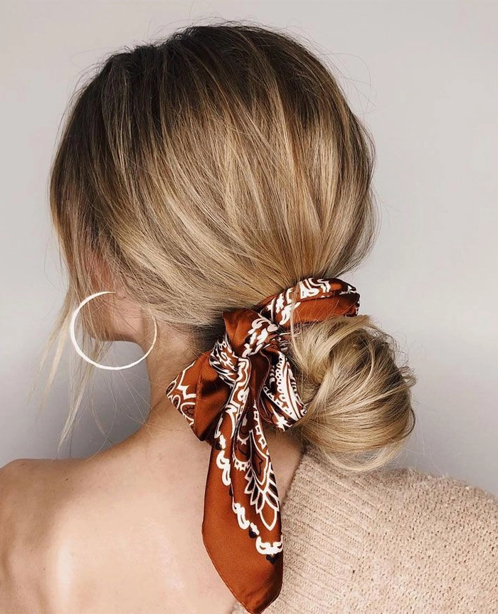 Woman wearing a stylish casual scarf hairstyle to protect hair in winter