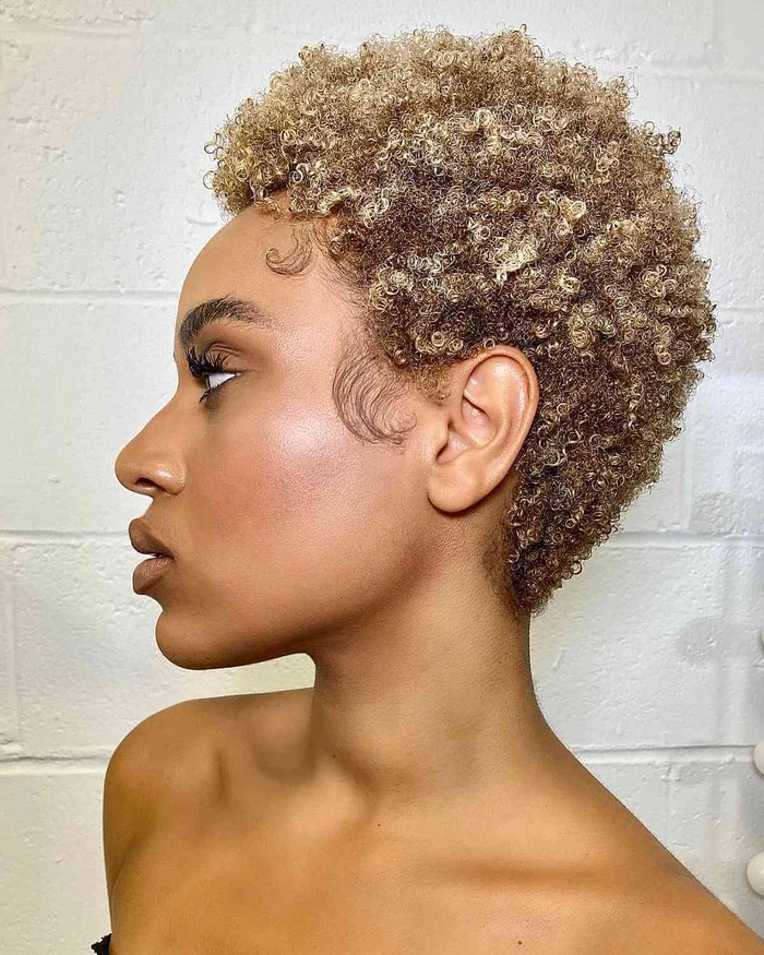 A woman with defined type 3 curls styled in a simple wash and go look for everyday wear