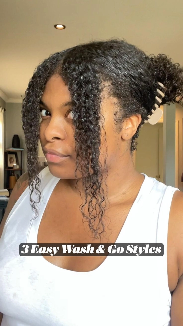 Woman with defined type 3 curls in a casual wash and go hairstyle, looking fresh and natural
