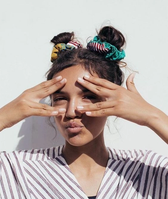Young woman styled in a quick scrunchie hairstyle perfect for 90s casual aesthetics