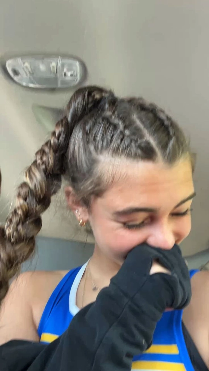 Casual double braids hairstyle perfect for sports and workouts Young woman with casual double braids styled for athletic activities