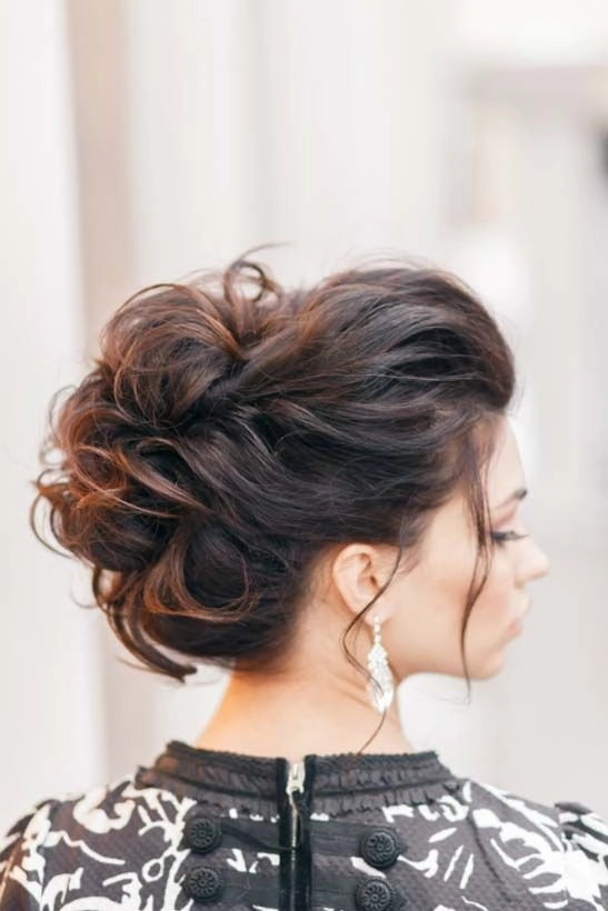 Intricate Date Night Updo for Special Occasions Elegant twisted updo with delicate braids and pearl pins for a romantic evening
