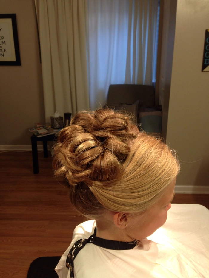 Detailed advanced hairstyle perfect for formal occasions and romantic evenings Intricate evening updo with woven sections and soft curls for a special date night