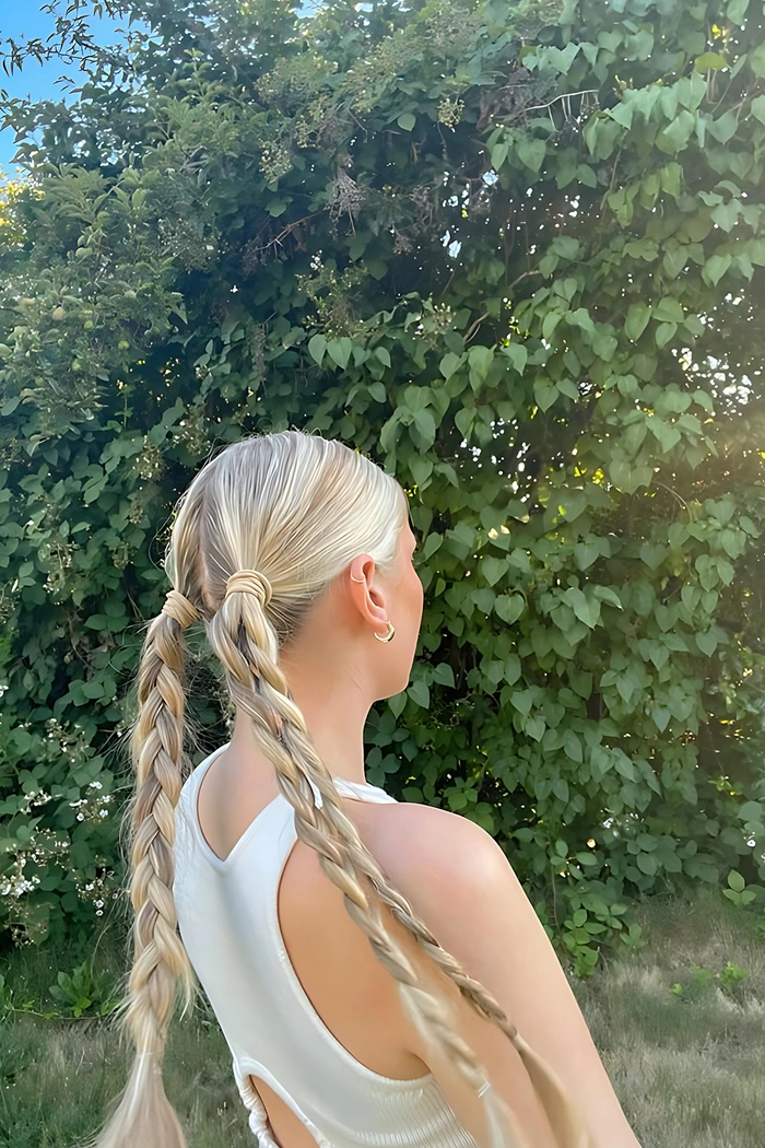 Thrill-safe braided styles for a memorable date night at the amusement park Woman with secure braided hairstyle enjoying an amusement park date on a roller coaster