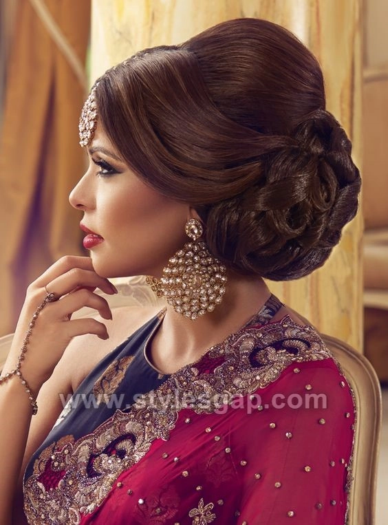 A sleek Asian evening updo with smooth strands and a polished finish, ideal for a date night hairstyle