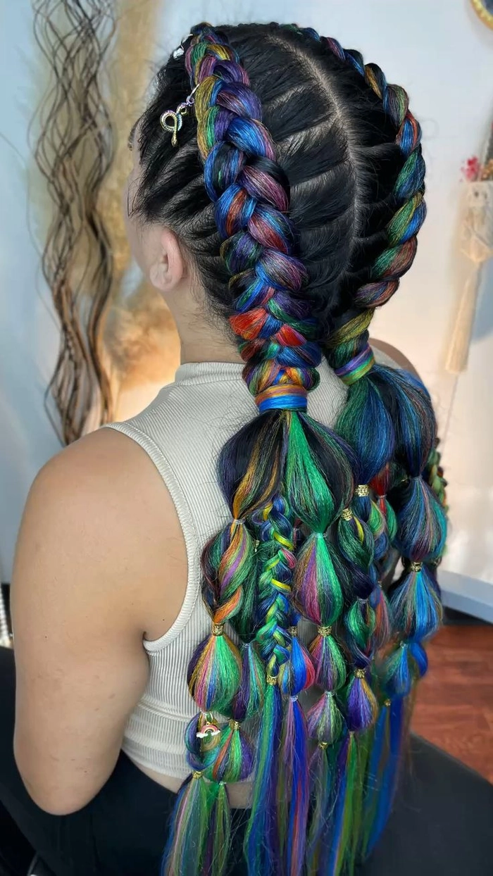 Image title: Braided hairstyle for a festive date night at an autumn harvest festival Alt text: Autumn harvest festival date night braids in a romantic updo style