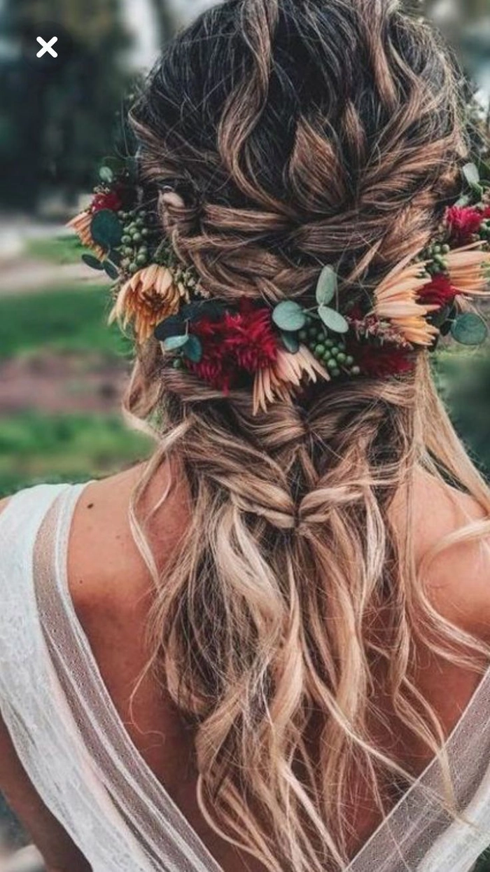 Boho chic braided crown perfect for romantic outdoor date night hair Woman wearing a boho chic braided crown hairstyle while on an outdoor date