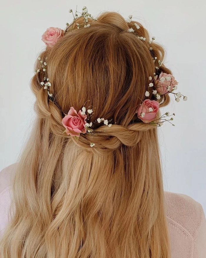 Boho braided crown hairstyle perfect for romantic outdoor date nights Woman with a boho chic braided crown hairstyle enjoying an outdoor date setting