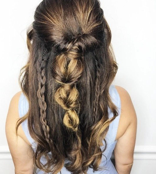 Romantic braided updo for a date night, showcasing long hair woven into an elegant twisted bun