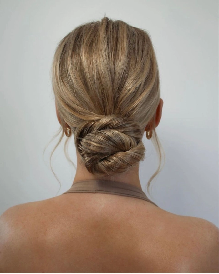 Elegant Low Bun for Romantic Dinner Date A classic low bun hairstyle perfect for upscale dinner dates, with sleek elegance