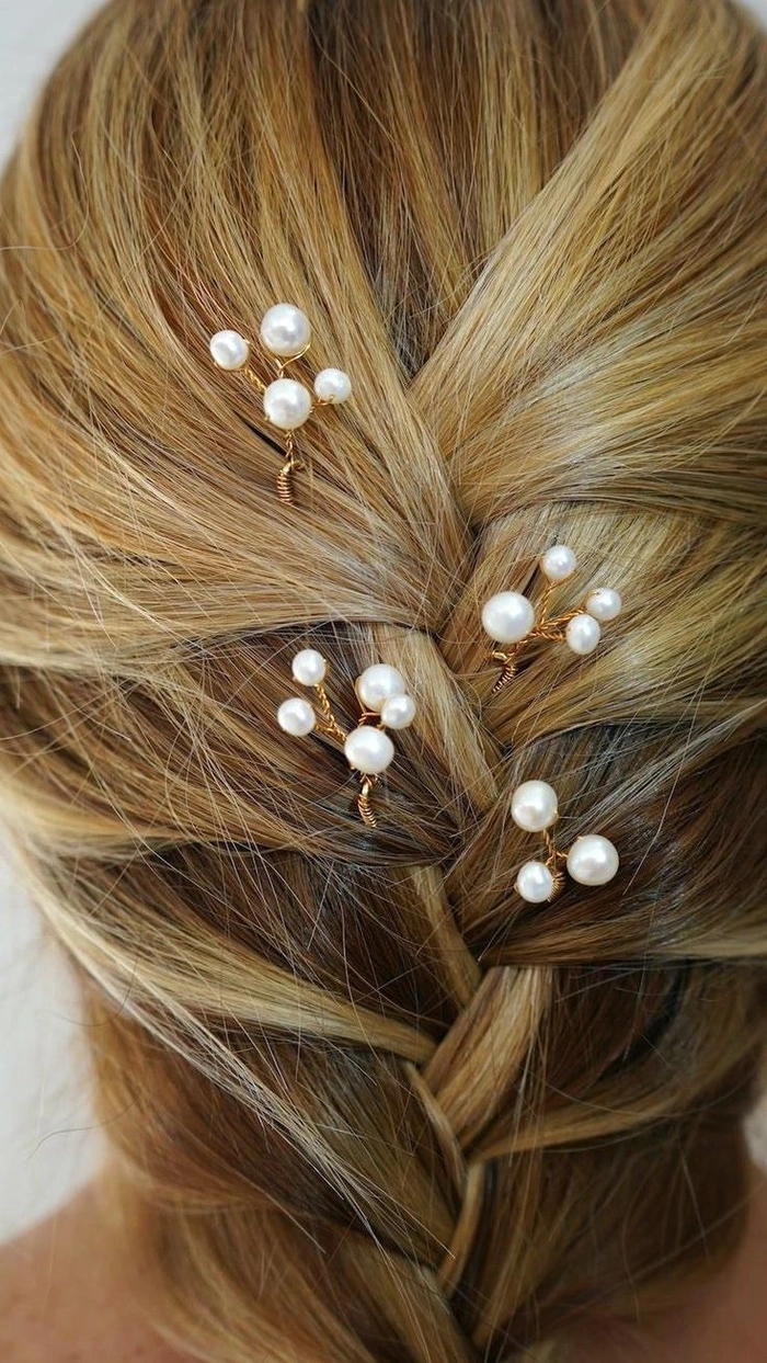 Elegant date night hairstyle adorned with pearl hairpins