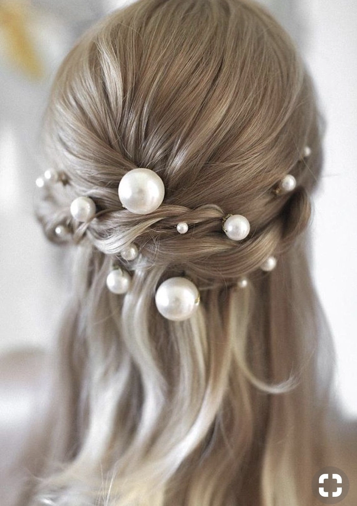 Date night hairstyle adorned with elegant pearl hairpins