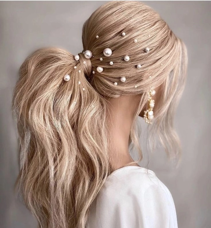 Elegant date night hairstyle adorned with pearl hairpins