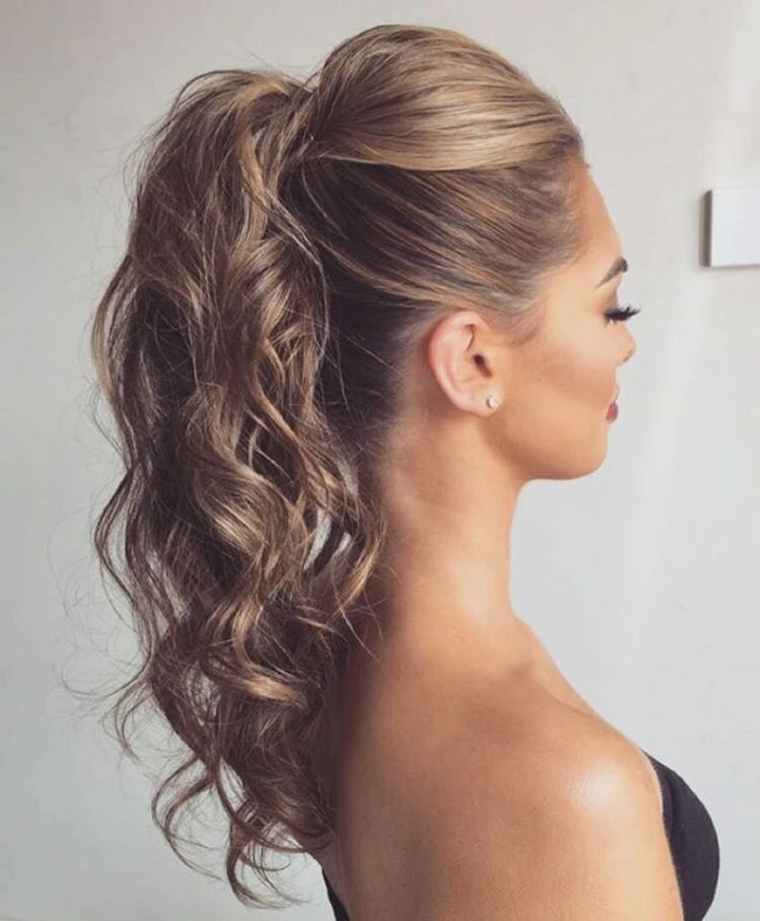 Romantic twisted updo showcasing blonde highlights for a date night look