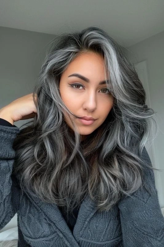 Elegant silver-haired woman with soft curls and a romantic side part for a date night look