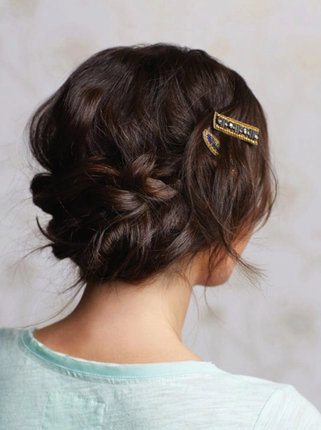 Elegant date night updo hairstyle featuring micro bangs with soft waves and a twisted bun