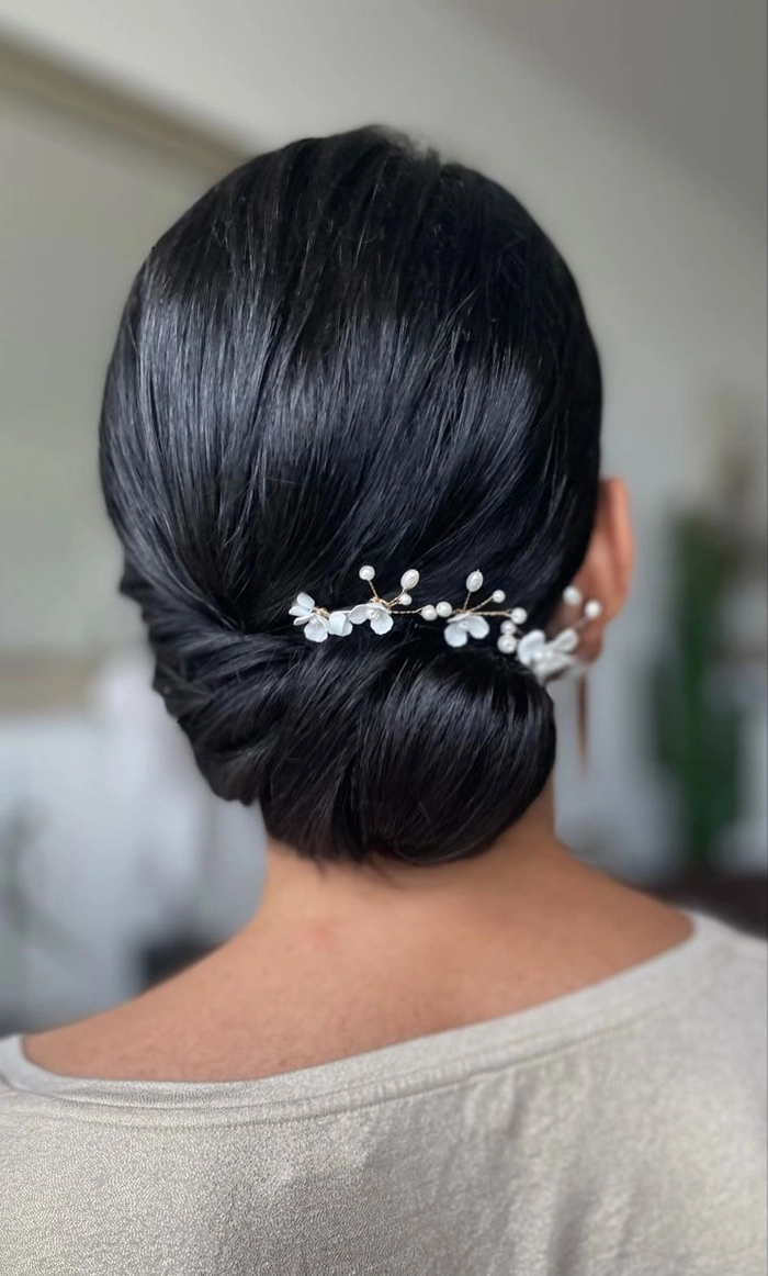 Elegant chignon hairstyle with jeweled hair comb for a romantic date night look