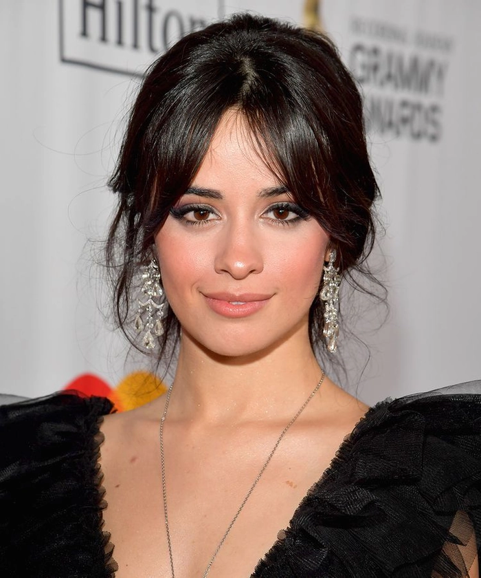 Elegant date night hairstyle featuring side swept bangs