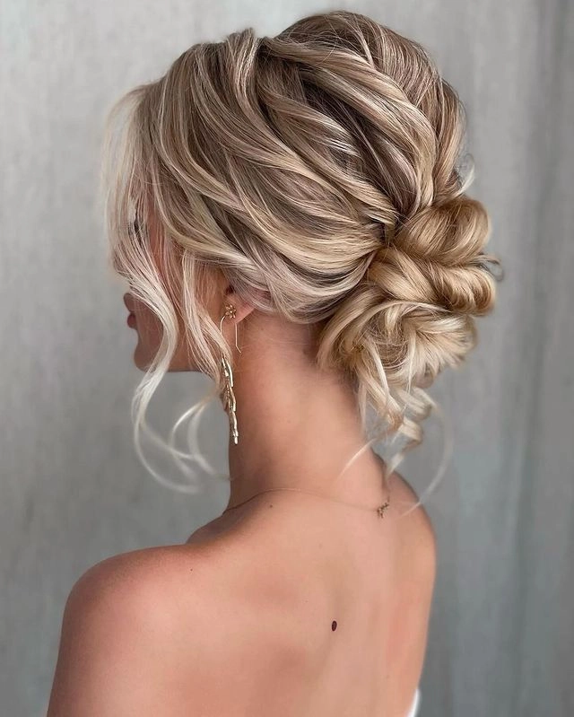 Chic feathered hair clips perfect for a romantic date night hairstyle A woman with a glamorous date night look featuring feathered hair clips in her styled hair