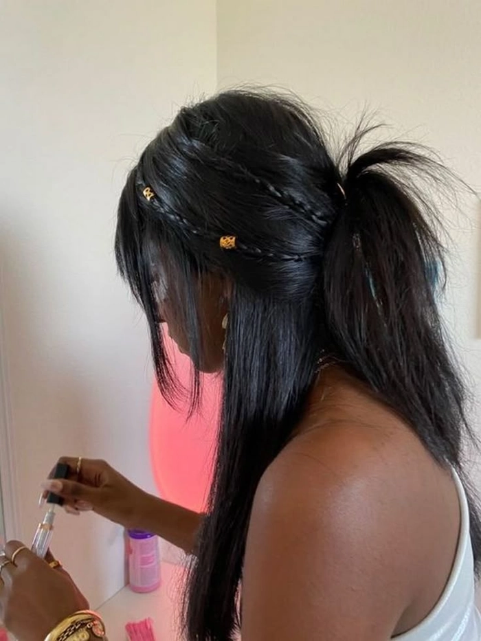 Edgy Gen Z date night hairstyle featuring a glossy high ponytail and minimalist accessories Gen Z trendy date night hair aesthetic with a sleek high ponytail and subtle curls