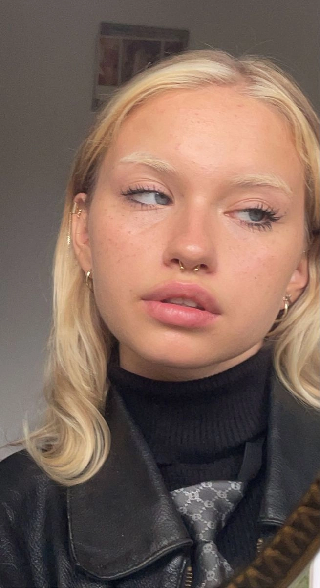 Modern date night hairstyle featuring smooth shiny waves and a clean center part Gen Z trendy date night hair with a sleek middle part and glossy, voluminous waves