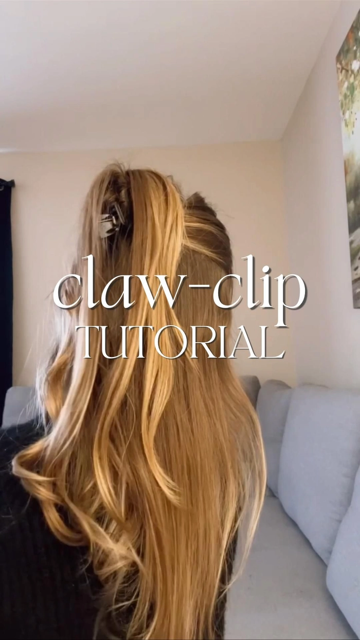 Romantic half up hairstyle elegantly fastened with a claw clip