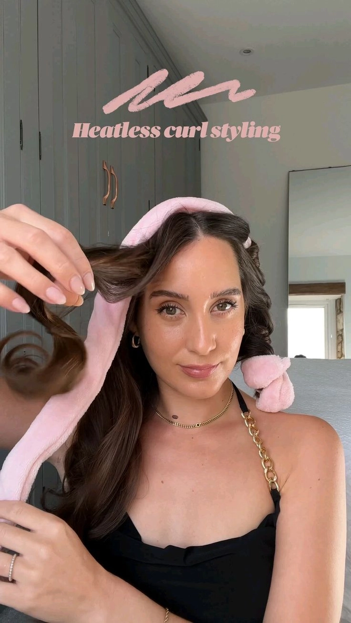 How to create romantic heatless curls for your next date night Woman with soft heatless romantic curls styled for a date night