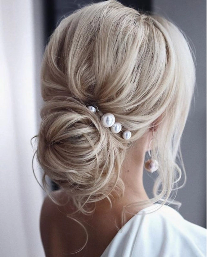 Elegant date night hairstyle featuring delicate pearl hairpins