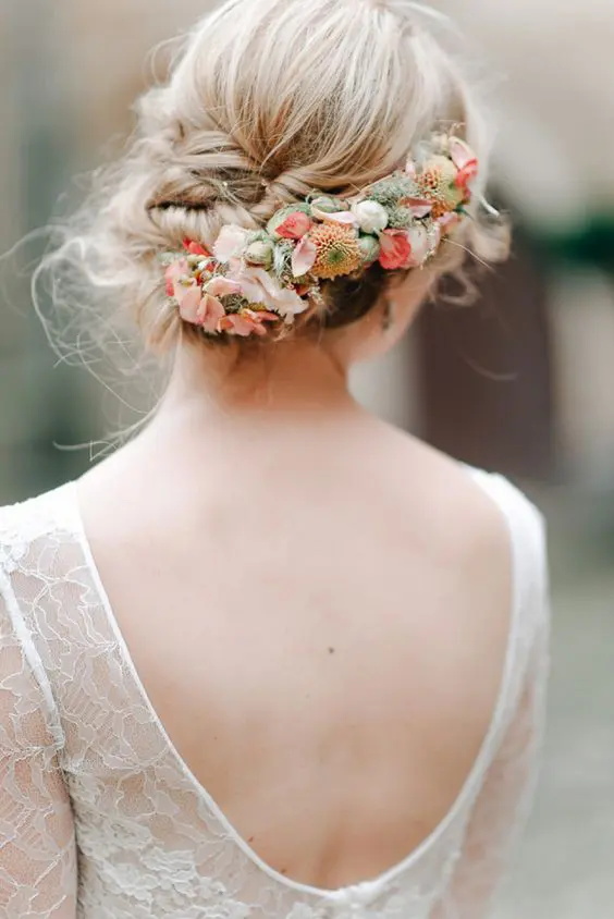 Romantic flower-adorned updo hairstyle perfect for a memorable date night Elegant romantic updo with fresh flowers for a romantic date night hairstyle