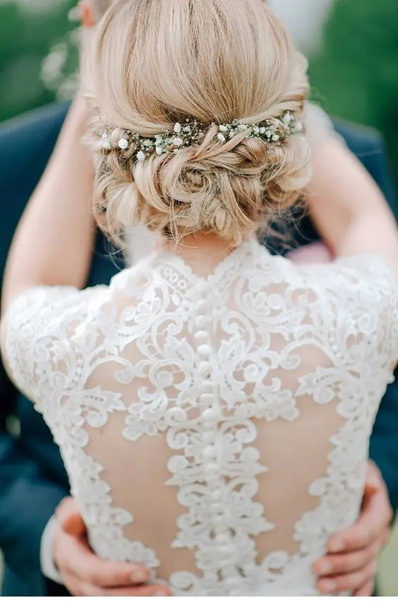 Romantic date night updo featuring fresh flowers Romantic updo with fresh flowers for a date night hairstyle