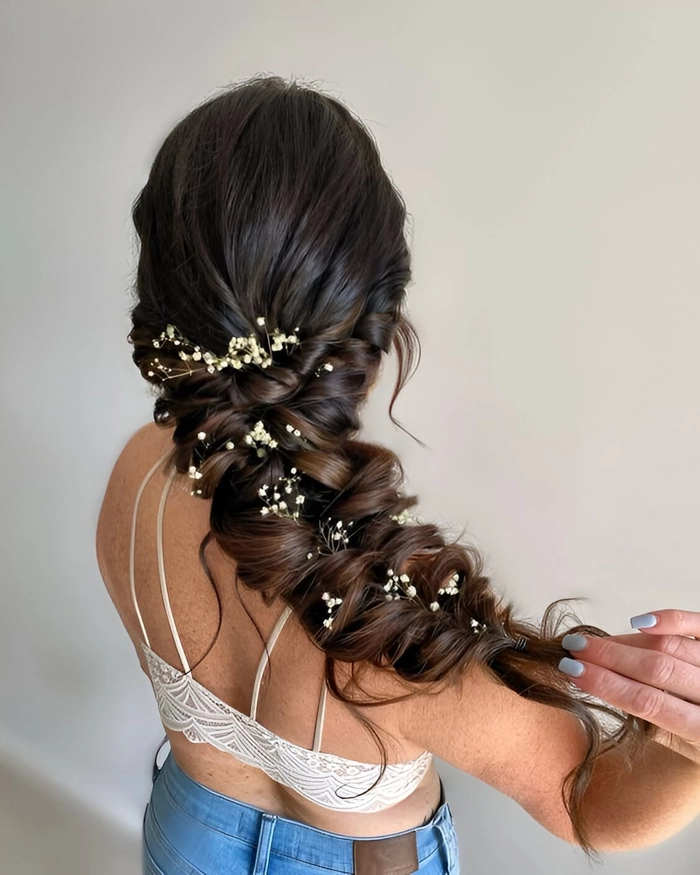 Romantic ribbon-woven braided updo for evening date nights Braided date night hairstyle with ribbon weaving and soft curls