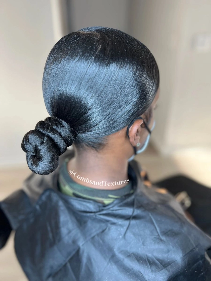 Elegant date night look featuring sleek buns tied with shiny silk ribbons Sleek buns wrapped with silk ribbons for a romantic date night hairstyle