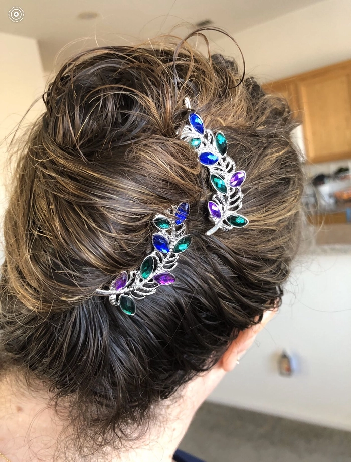 Romantic updo adorned with decorative bobby pins perfect for date night hair Elegant evening updo with sparkling decorative bobby pins for a romantic date night look