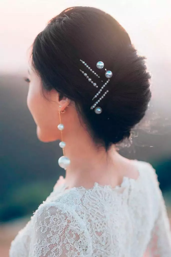 Romantic Date Night Updo Adorned with Sparkling Bobby Pins Elegant evening updo with decorative bobby pins for a date night look