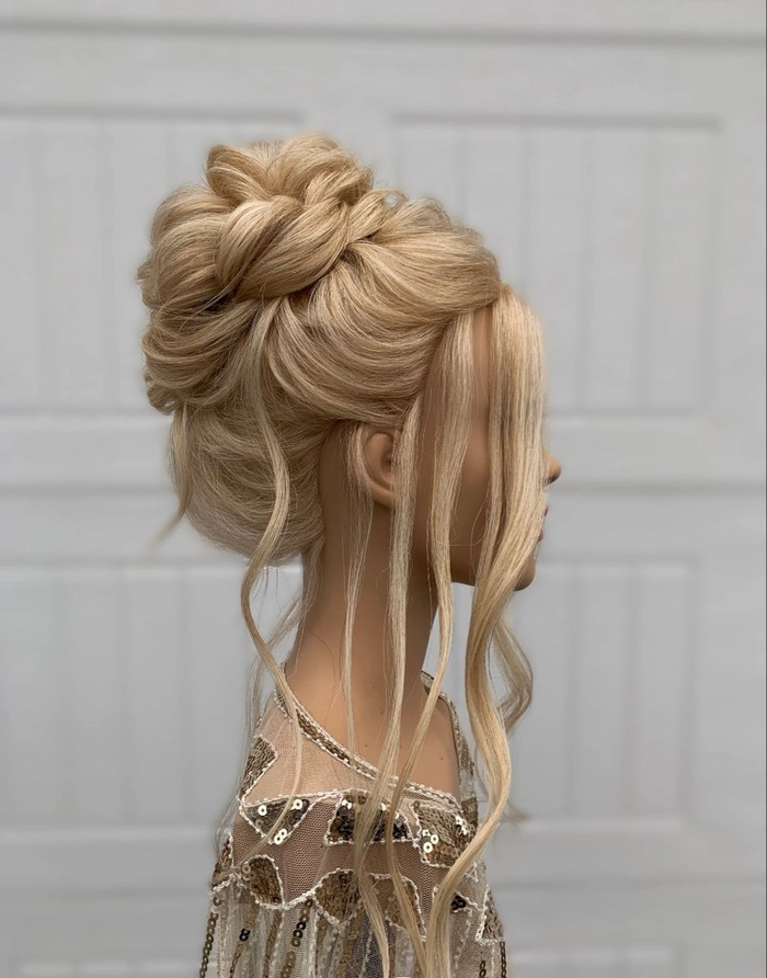 Beautiful textured layered updo with soft tendrils for an evening date