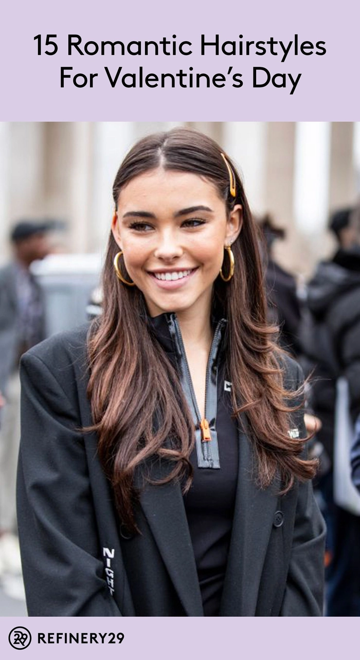 A couple hiking while wearing sweat-proof hairstyles perfect for an active date night