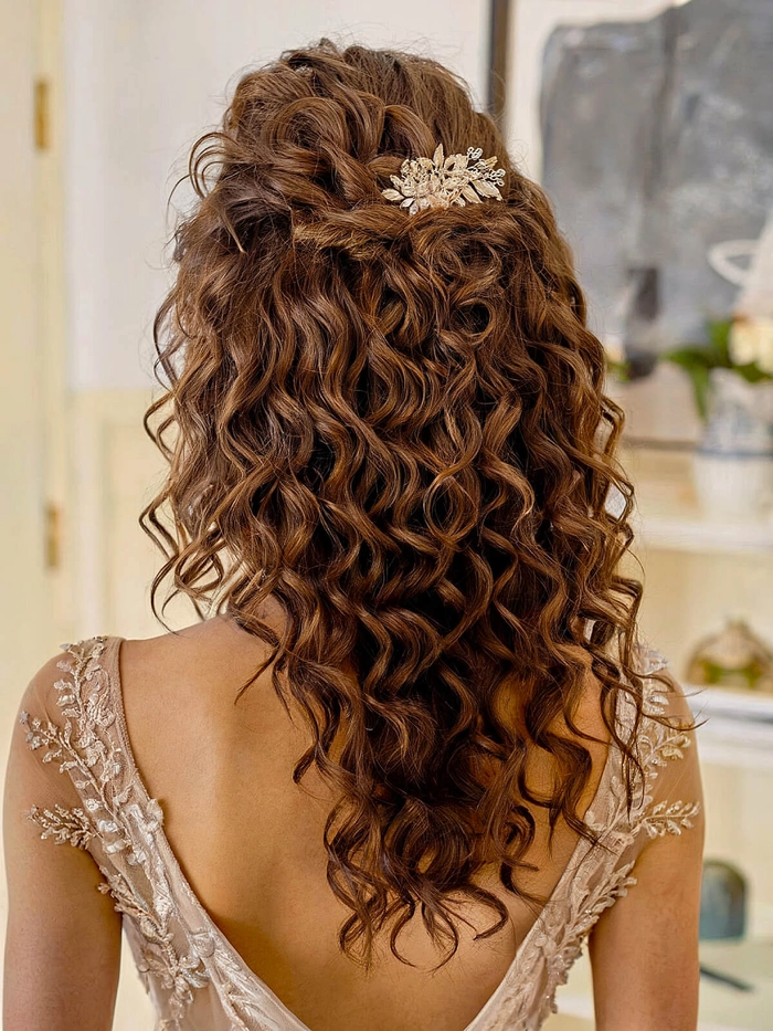 Elegant curly half-up hairstyle for anniversary dinner