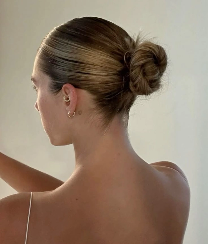 Sophisticated low bun for date night elegance Elegant classic low bun hairstyle for an upscale dinner date