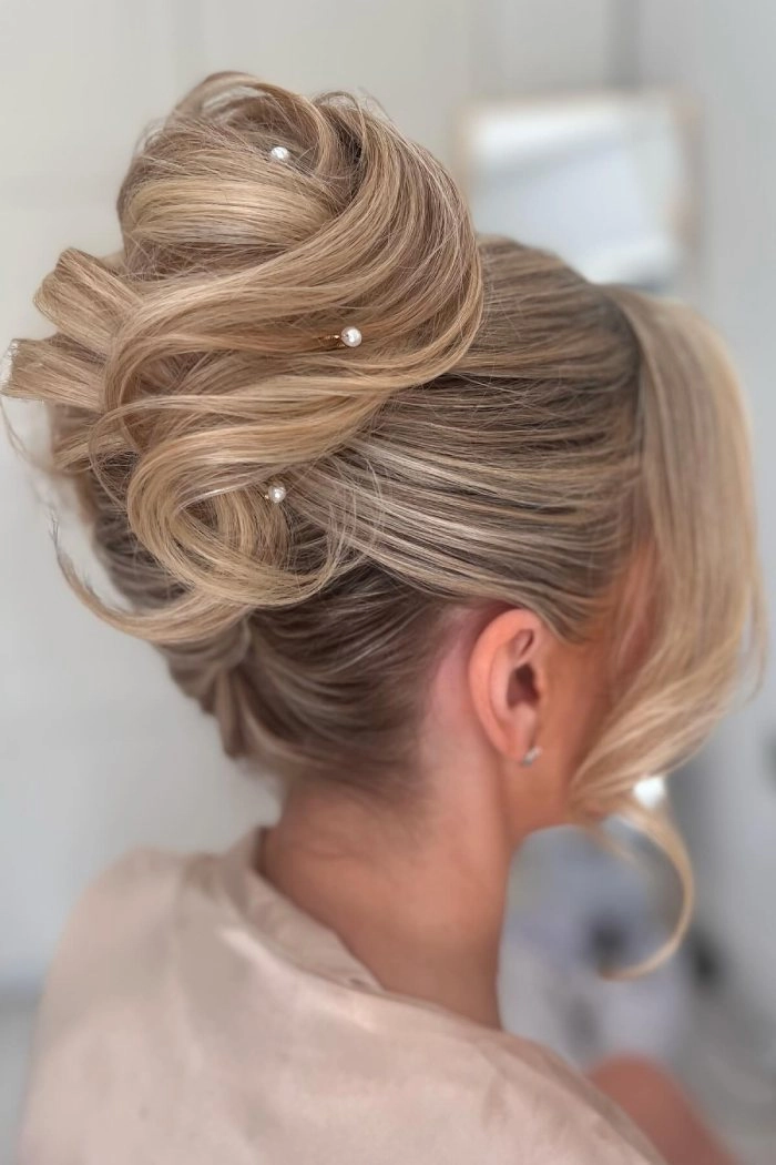 Romantic updo with soft tendrils framing the face for a date night look Soft face framing tendrils elegantly complement a romantic updo for date night hair
