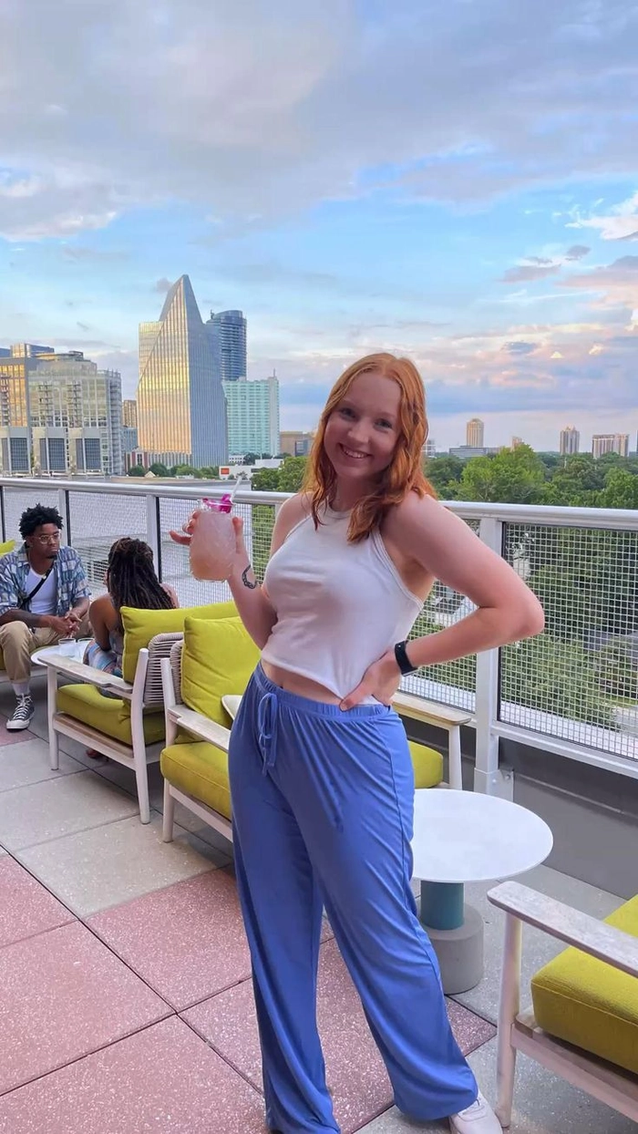 Wind-resistant hair for a perfect rooftop date night Couple enjoying romantic rooftop bar date with wind-resistant hairstyles