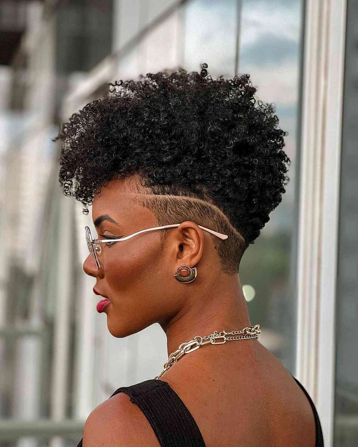 Stylish natural black woman with a chic updo and soft curls, perfect for a romantic date night