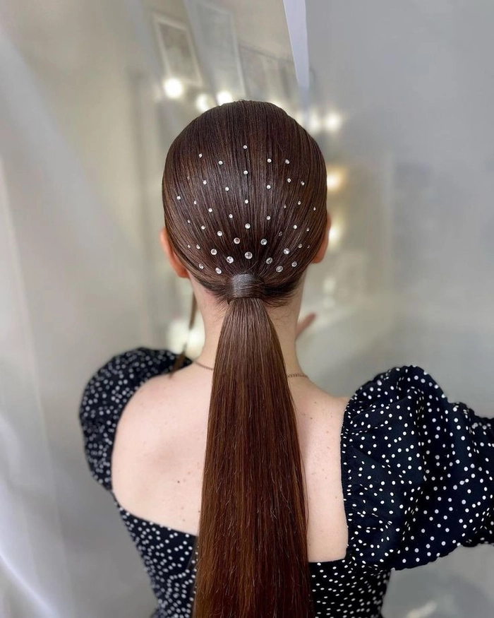 Long sleek ponytail hairstyle for a romantic dinner date