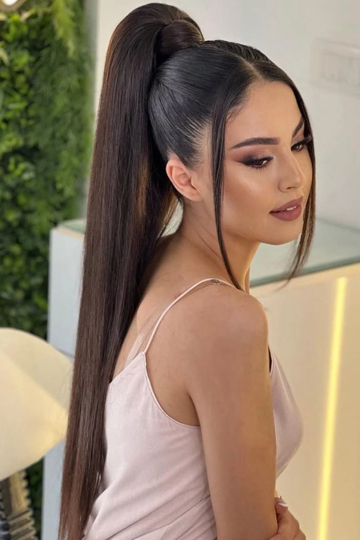 Long sleek ponytail hairstyle ideal for a romantic dinner date