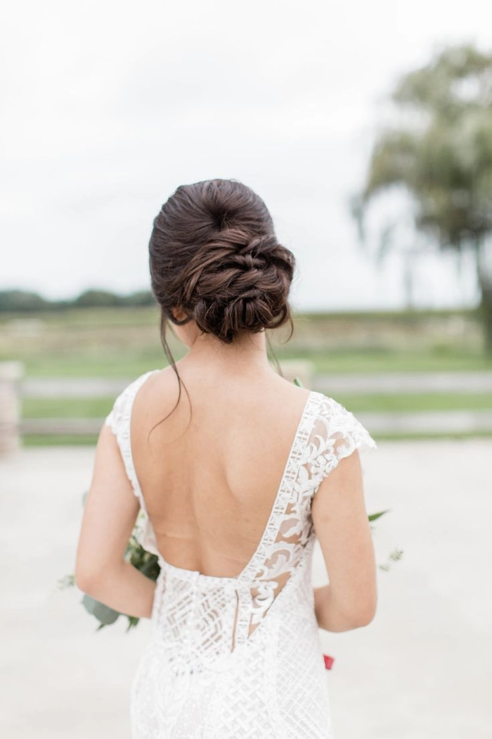Romantic evening updo with natural waves and soft tendrils for date night