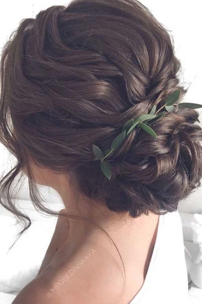 A romantic natural hair updo for evening wear, ideal for a date night look