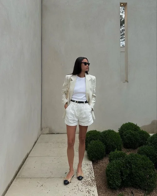 A woman transitioning her hairstyle from a sleek office look to a romantic date night style