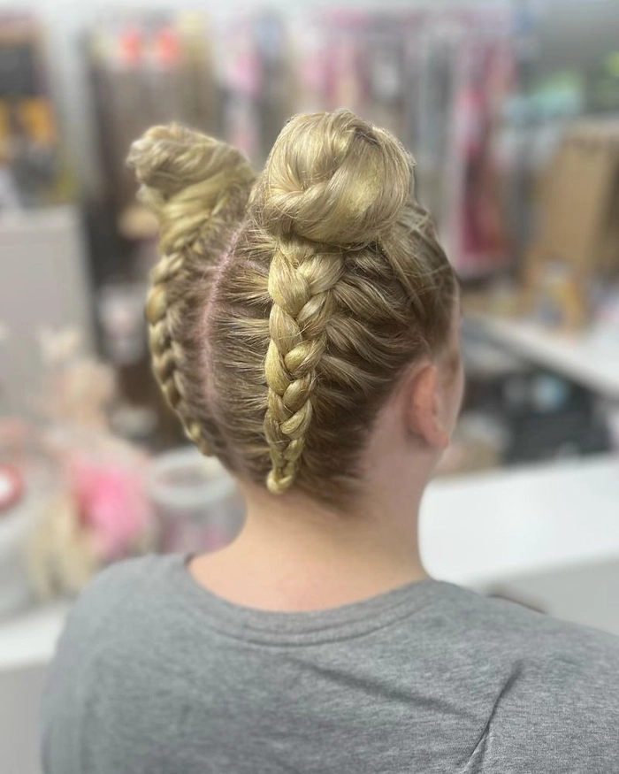 Woman sporting playful space buns for a casual date night