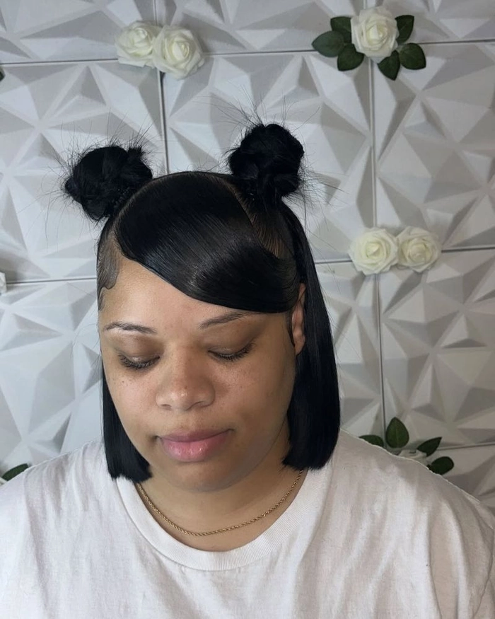 Woman wearing playful space buns for a casual date night look
