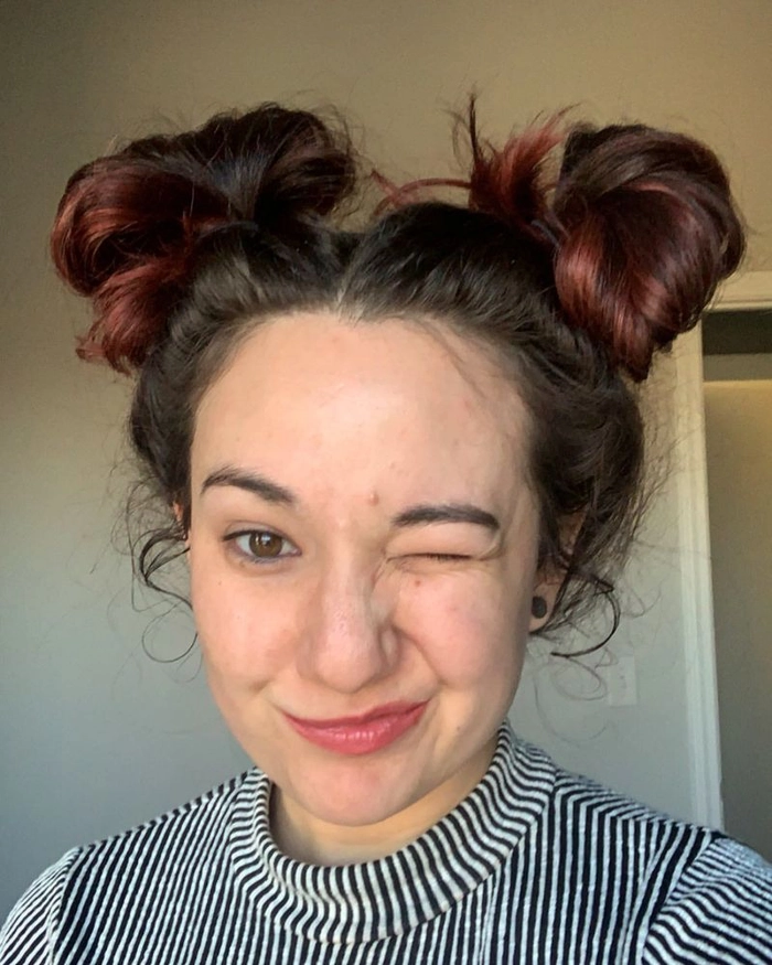 Playful space buns hairstyle perfect for a casual date night
